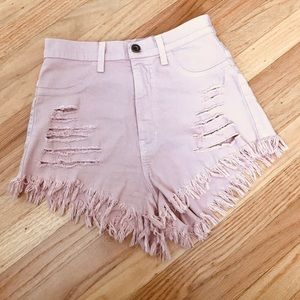 Pink distressed denim shorts